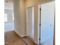 Bright hallway with doors to other rooms and vinyl flooring at 170 Vega Loop, Sanford, NC 27330