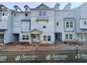 View of new construction townhome with gray siding and visible construction materials at 207 Pond View Ct # 3, Fuquay Varina, NC 27526