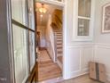 Inviting entryway featuring hardwood floors and a staircase at 209 Pond View Ct # 4, Fuquay Varina, NC 27526