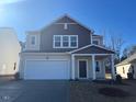 Two-story house with neutral siding and a large garage at 268 Babbling Brook Dr, Clayton, NC 27520