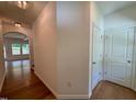 Hallway with hardwood floors, and white trim at 45 Covey Rise Way, Lillington, NC 27546