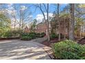 Brick home with a circular driveway and landscaping at 106 Alder Pl, Chapel Hill, NC 27517