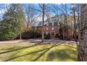 Two-story brick home with a long driveway at 106 Alder Pl, Chapel Hill, NC 27517