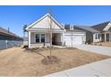 Attractive home exterior featuring a well-maintained lawn, neat landscaping, and a spacious driveway at 2317 Forsythia Trl, Fuquay Varina, NC 27526
