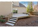 Wooden deck with steps leading to the backyard at 2633 Farlow Gap Ln, Raleigh, NC 27603