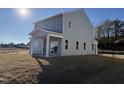 Spacious backyard with a covered patio, perfect for outdoor entertaining and relaxation at 346 Tormore, Homesite 125, Sanford, NC 27330