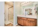 Bathroom with vanity, shower, and wood flooring at 105 Gentle Rio Ct, Garner, NC 27529