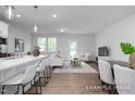Open concept living space with kitchen island, living area, and dining space at 3934 Well Fleet Drive, Fuquay Varina, NC 27526