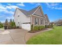 Attractive house with a two-car garage, landscaped front yard, and a well-maintained driveway at 4236 Aviemore, Burlington, NC 27215