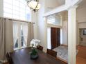 Elegant dining room with hardwood floors, large windows, and a beautiful chandelier at 4701 Sandy Bay Cir, Raleigh, NC 27603