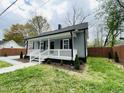 Lovely home with manicured lawn, featuring a covered porch and a well-maintained exterior at 1003 W Anderson St, Selma, NC 27576
