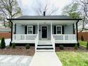Inviting home with a covered front porch, offering curb appeal and a welcoming entrance at 1003 W Anderson St, Selma, NC 27576