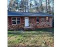 Brick ranch house with red shutters, and a small front porch at 2800 Coleman Loop Rd, Hillsborough, NC 27278