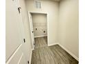 Conveniently located laundry room with washer and dryer hookups and shelving at 166 Vega Loop, Sanford, NC 27330