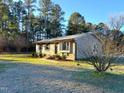 Brick ranch home with mature trees and landscaping at 2253 Nc Highway 96 S, Franklinton, NC 27525