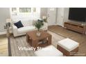 Bright living room features modern furniture, hardwood floors, and large windows at 2253 Nc Highway 96 S, Franklinton, NC 27525