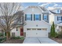 Charming two-story home with a two car garage and beautiful red door at 226 Begen St, Morrisville, NC 27560