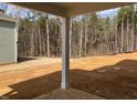 Expansive backyard with a wooded backdrop, offering privacy and a serene outdoor space at 322 N Maple Walk Walk # 237, Garner, NC 27529