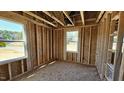A framed bedroom featuring multiple windows to create a bright interior at 3852 Well Fleet Drive, Willow Springs, NC 27592