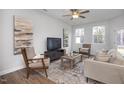 Comfortable living room with modern decor, natural light, and contemporary furnishings for relaxation at 3856 Well Fleet Drive, Fuquay Varina, NC 27526
