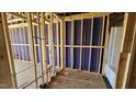 Bathroom under construction, exposing plumbing, partial wall covering and stand-up shower and window at 3858 Well Fleet Drive, Willow Springs, NC 27592