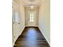 Traditional entryway featuring luxury vinyl plank floors and a transom window door at 40 Moonraker Dr, Spring Hope, NC 27882