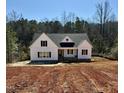 Newly constructed home with a dark roof, white siding and partially cleared lot at 40 Moonraker Dr, Spring Hope, NC 27882