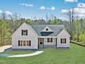 Inviting home with a stone foundation and freshly cut lawn at 40 Moonraker Dr, Spring Hope, NC 27882