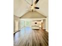Open concept living room and kitchen featuring a high vaulted ceiling at 40 Moonraker Dr, Spring Hope, NC 27882