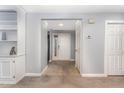 Inviting entryway with tile flooring and a view of the front door and interior space with built-in shelving at 42 Melstone Turn, Durham, NC 27707
