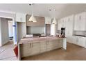 Modern kitchen with large island and white cabinetry at 7813 Ailesbury Rd, Wake Forest, NC 27587