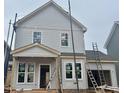 New two-story home under construction with light gray siding and white trim at 85 Windchime Ct, Fuquay Varina, NC 27526
