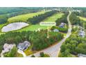 Buildable lot in golf course community with wooded area and views of homes at 1245 Golfers Vw, Pittsboro, NC 27312