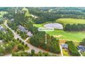 Buildable lot in golf course community with wooded area and views of homes at 1245 Golfers Vw, Pittsboro, NC 27312