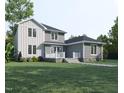 Two-story house with gray and white siding, deck, and landscaping at 183 Lookout Rdg, Pittsboro, NC 27312