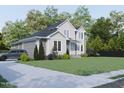 Two-story house with gray and white siding, landscaping, driveway, and car at 183 Lookout Rdg, Pittsboro, NC 27312