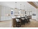 Beautiful kitchen featuring a large center island with seating, sleek stainless steel appliances, and ample counter space at 2908 Frances Marie Ln, Raleigh, NC 27603