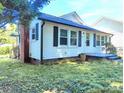 Single Gathering home with a well-maintained lawn and new roof at 826 Carter Ave, Durham, NC 27703