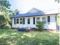 Single-story home featuring a new roof and dark shutters at 826 Carter Ave, Durham, NC 27703