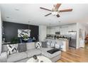 Open-concept living space with a comfortable sofa, dining area, and a well-equipped kitchen at 236 George Pine Way, Knightdale, NC 27545