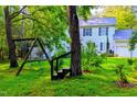 A spacious backyard featuring a swing set and lush greenery at 340 Andrews Store Rd, Pittsboro, NC 27312