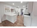 Modern white kitchen with quartz countertops and new appliances at 1805 Pritchard Pl, Durham, NC 27707