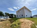 New home featuring a rear view with sod in the backyard at 211 Drayton Hall Ln, Sanford, NC 27330