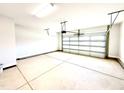 Spacious, clean two-car garage featuring an automatic door opener and ample space for storage at 211 Drayton Hall Ln, Sanford, NC 27330