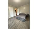 This staged bedroom features plank flooring, paint, and decor at 1118 Jackson St, Burlington, NC 27217