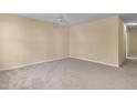 Spacious bedroom featuring neutral carpeting and a ceiling fan for added comfort at 1732 Great Bend Dr, Durham, NC 27704