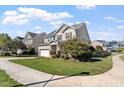 Beautiful two-story home with a manicured lawn and inviting curb appeal in a friendly neighborhood at 2526 Snowdrop Ct, Apex, NC 27502