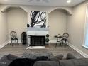 Elegant living room featuring a fireplace and modern decor at 334 E Andrews Ave, Henderson, NC 27536