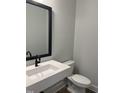 Contemporary powder room with a floating sink, modern fixtures, and clean lines at 704 Portia Way, Homesite 15, Morrisville, NC 27560