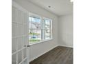 A spacious living room with light gray wood-look floors and plenty of natural light at 1128 Middlecrest Dr, Rocky Mount, NC 27804